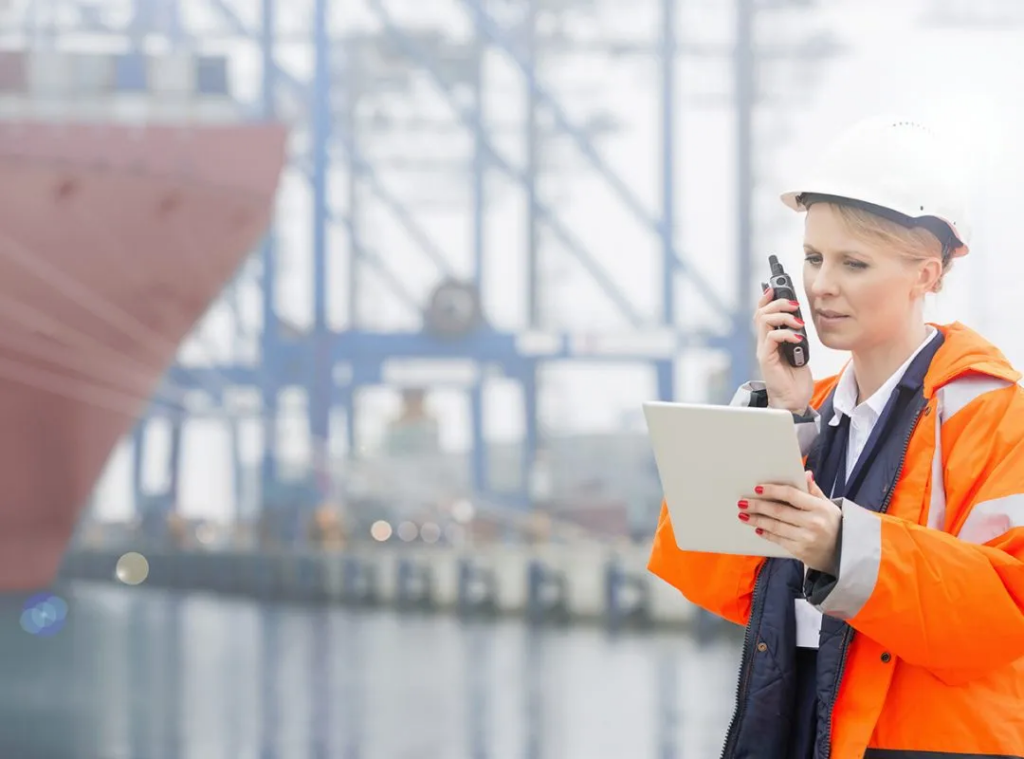 Woman wearing HiVis Safety Workwear doing operations work for a transport industry