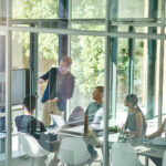 Sales-Driven-Organisation-A-group-of-employees-having-a-meeting