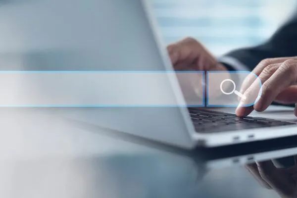 Search-Engine-Optimisation-Service-Businessman-using-a-search-engine-on-a-laptop