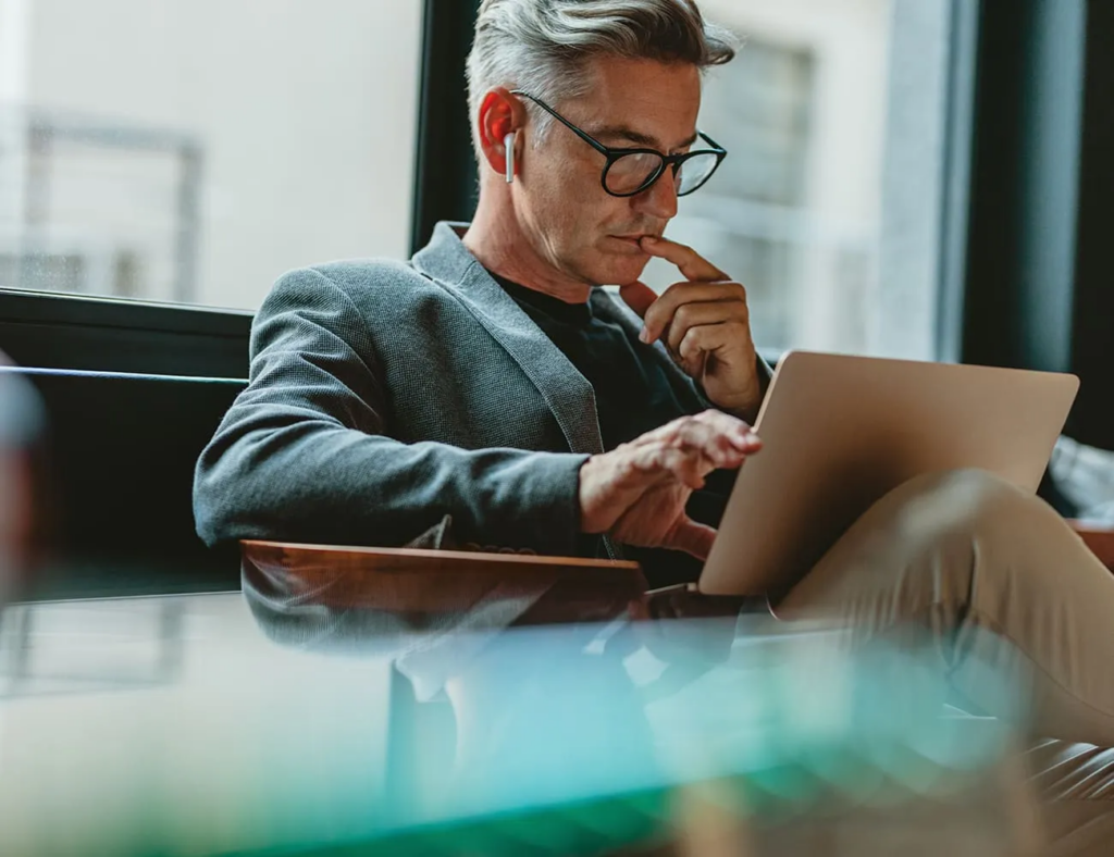 Man doing research using AI to provide clear solution to a pressing business issue
