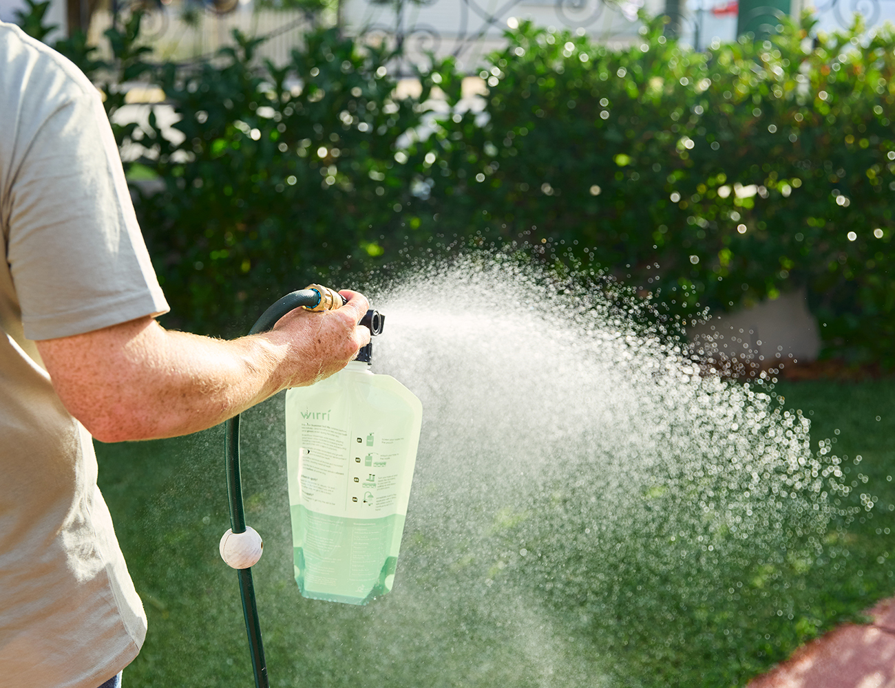 Lawn Care Tips_ Managing Lawns in Drought-Prone Areas _ man watering the lawn