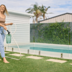 Lawn-Solutions-Woman-using-a-product-on-lawn