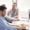 In-the-Trenches-podcast-Business-person-working-with-a-laptop
